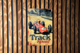 a sign on the side of a wooden wall