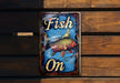 a fish on sign on a wooden wall
