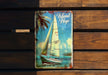 a book with a picture of a sailboat on it