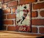 a painting of a soccer player on a brick wall