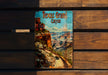 a book sitting on top of a wooden bench