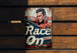 a sign on a wooden wall that says race on