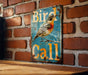 a bird is sitting on a sign on a brick wall