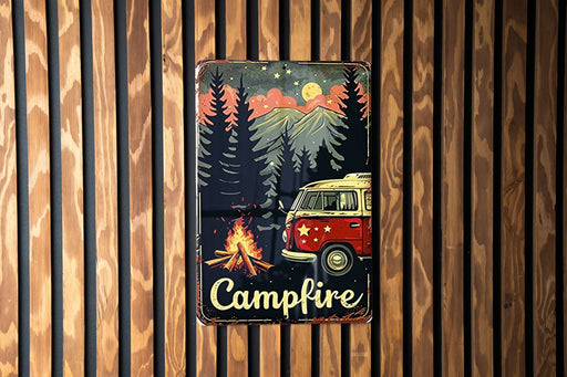 a campfire sign hanging on a wooden wall
