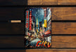 a picture of a city on a wooden bench