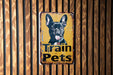 a sign on a wooden wall that says train pets