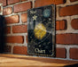 a wooden table topped with a sign that says star chart