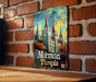 a picture of a building on a brick wall