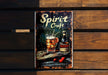 a metal sign with a picture of a bottle of spirit craft