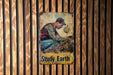a picture of a man sitting on top of a pile of dirt