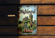 a sign on a wooden bench that says highland home