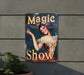 a sign on the side of a building advertising a show