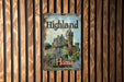 a sign on a wooden wall with a castle in the background