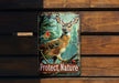 a picture of a deer on a wooden bench