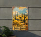 a painting of a desert scene on the side of a building