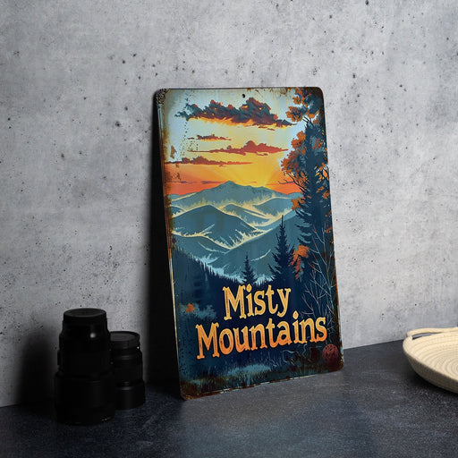 a metal sign that says misty mountains on it