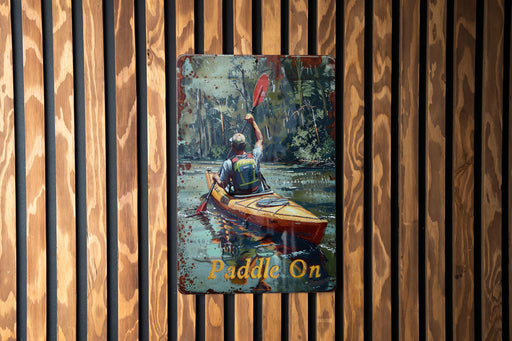 a painting of a man in a kayak on a wooden wall