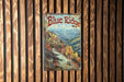 a blue ridge sign hanging on a wooden wall