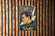 a sign on a wooden wall that says cut sharp