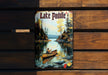 a picture of a man in a canoe on a lake