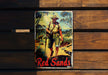 a red sands cigarette tin sitting on top of a wooden bench