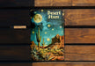 a book sitting on top of a wooden bench