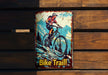 a bicycle trail sign mounted to a wooden wall
