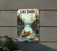a lake paddle sign hanging on the side of a building