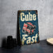 a sign that says cube fast on a table