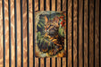 a picture of a cat on a wooden wall
