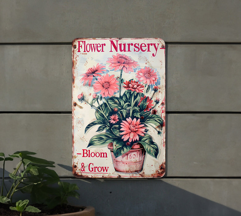 a flower nursery sign hanging on a wall