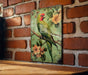 a painting of a bird on a brick wall