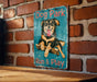 a dog park sign on a brick wall