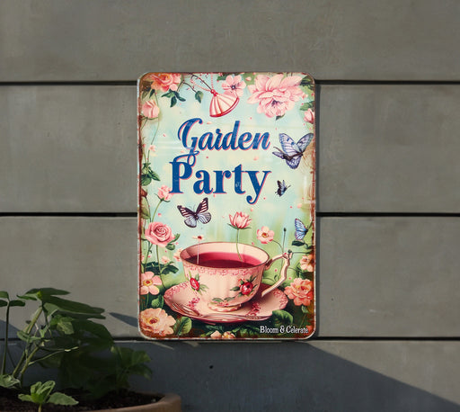 a garden party sign hanging from the side of a building