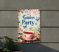 a garden party sign hanging from the side of a building