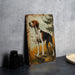 a painting of a dog on a wall next to a plate
