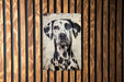 a picture of a dalmatian on a wooden wall