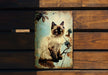 a picture of a cat sitting on a wooden bench
