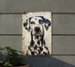 a dalmatian dog painted on a metal sign