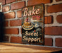 a sign on a brick wall that says bake sweet support