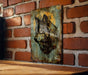 a painting of a wolf on a brick wall