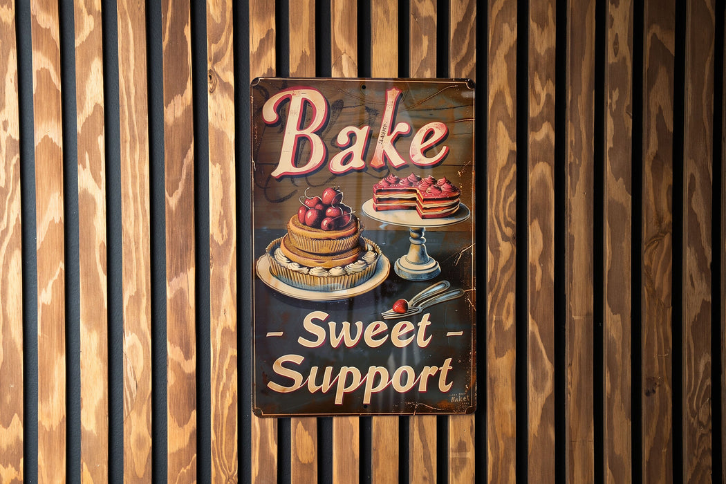 a sign on a wall that says bake sweet support
