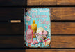 a baby shower sign on a wooden bench