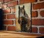 a picture of a horse on a brick wall