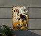 a painting of a dog on a wall next to a potted plant