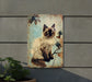 a picture of a cat sitting on top of a sign