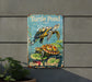 a turtle pond sign on the side of a building