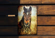 a picture of a horse on a wooden wall