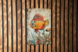 a painting of a fish on a wooden wall
