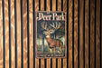 a deer park sign mounted to a wooden wall